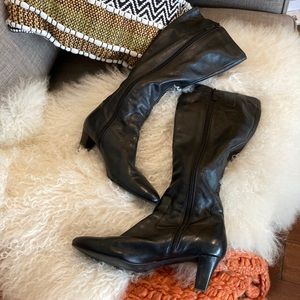 Beautifully crafted black leather Cole Haan zipper boot. Comfortable classic.